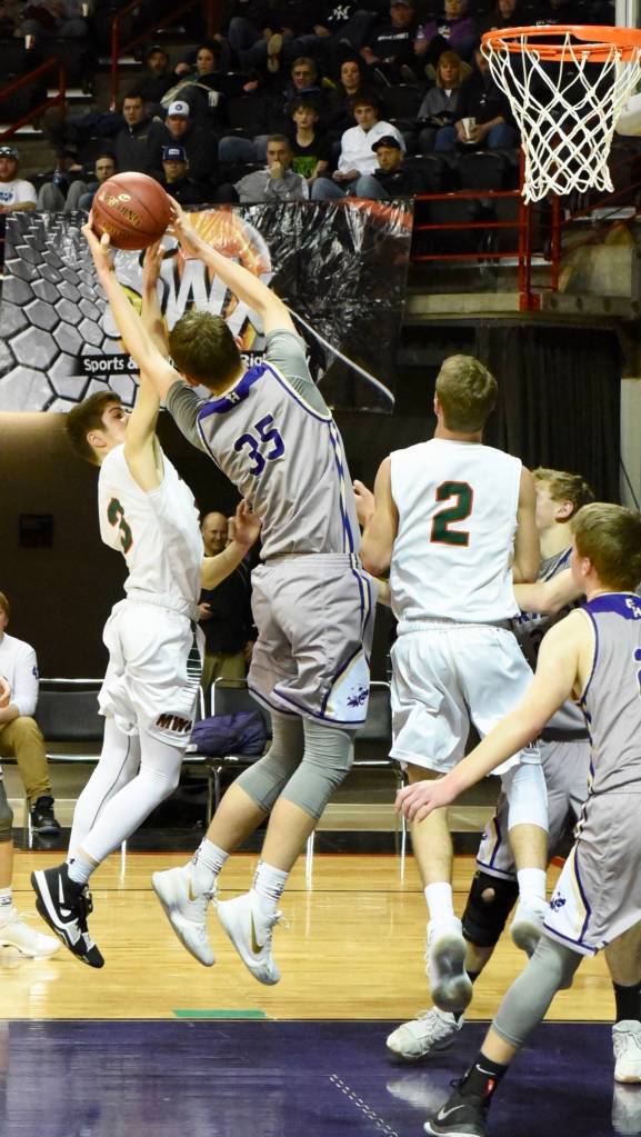 <em><em><em><em><strong>Contributed photo/ John Stimpson</strong></em></em></em></em>                                <em>Marshall Clark fights for a rebound.</em>