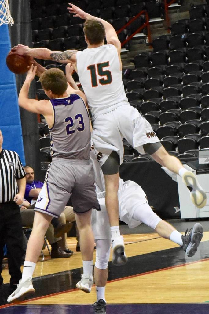 <em><em><strong>Contributed photo/ John Stimpson</strong></em></em>                                <em>Rio Black has his hands full on this rebound under the basket.</em>