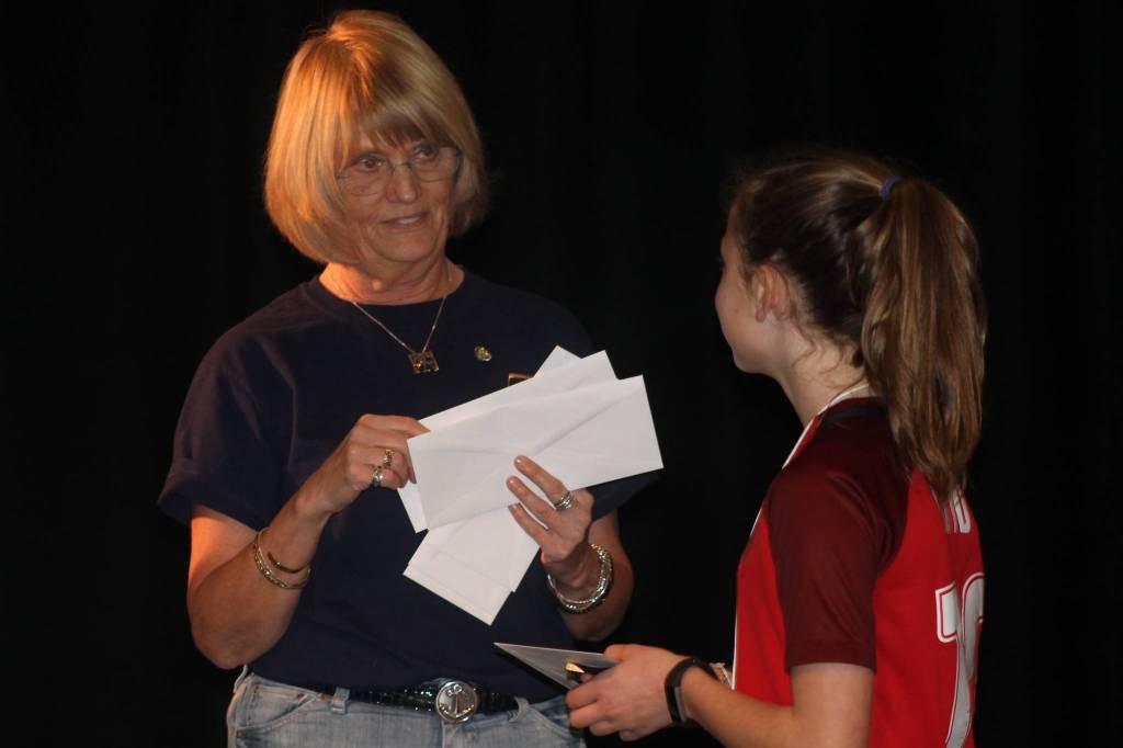 Staff photo/Heather Spaulding                                Second-place winner Meg Carrier receives her check.