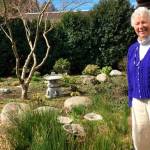 Contributed photo/PIMC                                Carolyn Haugen stands at the garden entrance at PIMC.