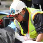 Staff photo/Hayley Day                                Members of local rescue crews attend to the student actors during the program.