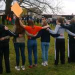 Contributed photo                                Students hold signs during the April 20 walkout.