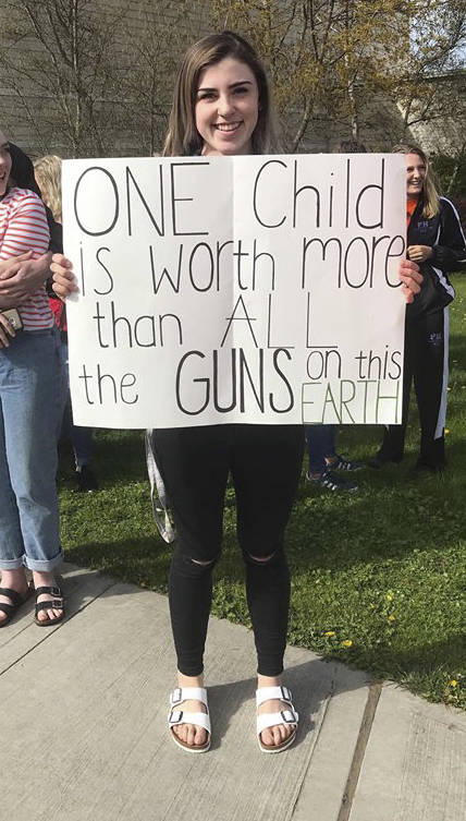 Contributed photo                                A student shows her sign at the April 20 walkout.