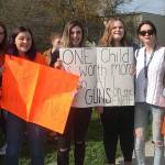 Contributed photo                                Students hold signs during the April 20 walkout.