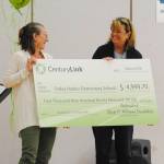Staff photo/Tate Thomson                                FHES teacher Susan Kareken receives the check.