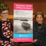 Staff photo/Hayley Day                                Lisa Salisbury, Washington State Ferries online haiku contest, and Washington State Poet Laureate Claudia Castro Luna hold a poster of the summer WSF schedule, where Salisburys poem will be showcased.