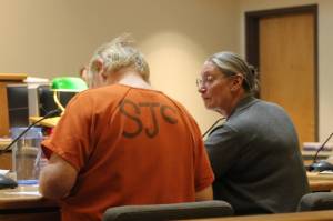 Staff photo Heather Spaulding. Eric Kulp talks with his council, Colleen Kenimond.
