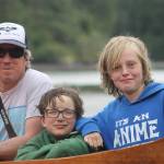 Staff photo/Hayley Day                                From left to right: Gianna Moalli, Whiley McCutchen, Matt Wickey, Nico Tate, and Shaw Sandstrom sit next to the canoes during a campout at Wescott Bay on June 6.