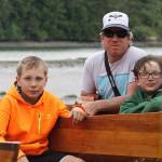 Staff photo/Hayley Day                                From left to right: Gianna Moalli, Whiley McCutchen, Matt Wickey, Nico Tate and Shaw Sandstrom sit next to the canoes during a campout at Wescott Bay on June 6.