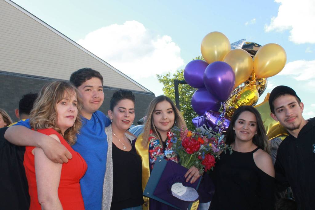 Staff photo/Heather Spaulding. Queyry Ayala celebrates after the ceremony.