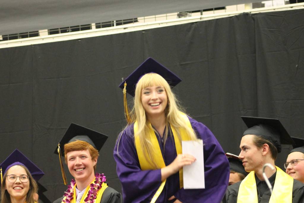 Staff photo/Heather Spaulding. Graduate Kelly Payne receives an award.
