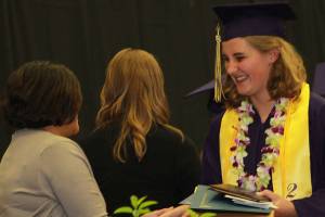 Staff photo/Heather Spaulding. Tenly Nelson receives her diploma.
