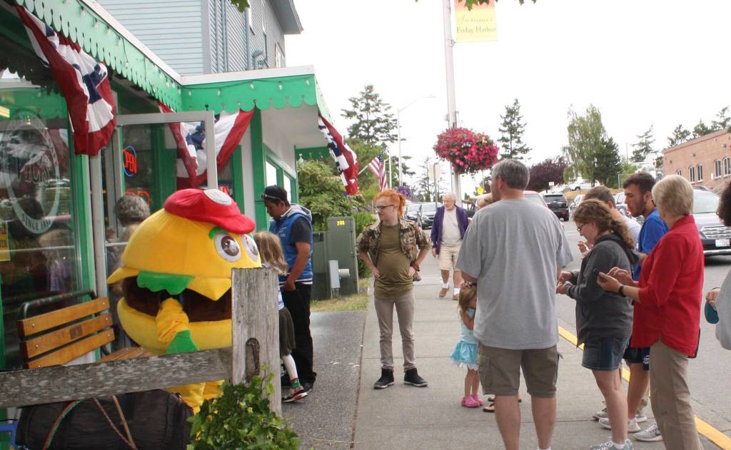Staff photo/Hayley Day                                Long lines formed during the 60th-anniversary celebration, which offered 1958 pricing.