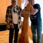 Contributed photo                                Ken Balcomb and artist Jim Burgess with a dorsal fin.