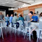 Staff photo/Tate Thomson                                Patrons enjoy the new bar at its soft opening on July 26.