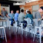 Staff photo/Tate Thomson                                Patrons enjoy the new bar at its soft opening on July 26.