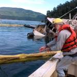 Contributed photo/ Julie Knight. Alwyn Jones and Steve Lillestol set oil containment boom around the MV Sanctuary in Judd Cove. IOSAs main response vessel, the Sea Goose, is in the background. Photo by