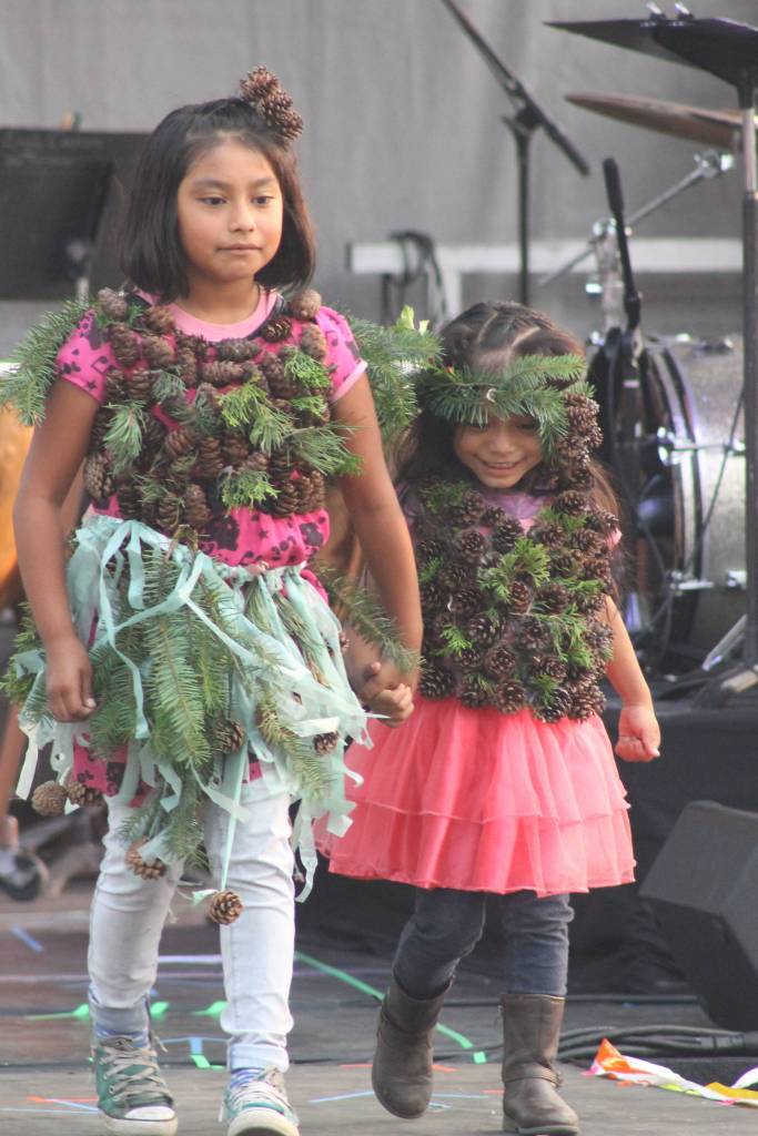 Staff photo/Heather Spaulding Sisters show off their evergreen creation.
