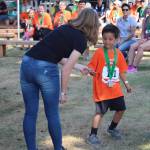 Staff photo/Hayley Day                                Participants attend the medal ceremony after the race.
