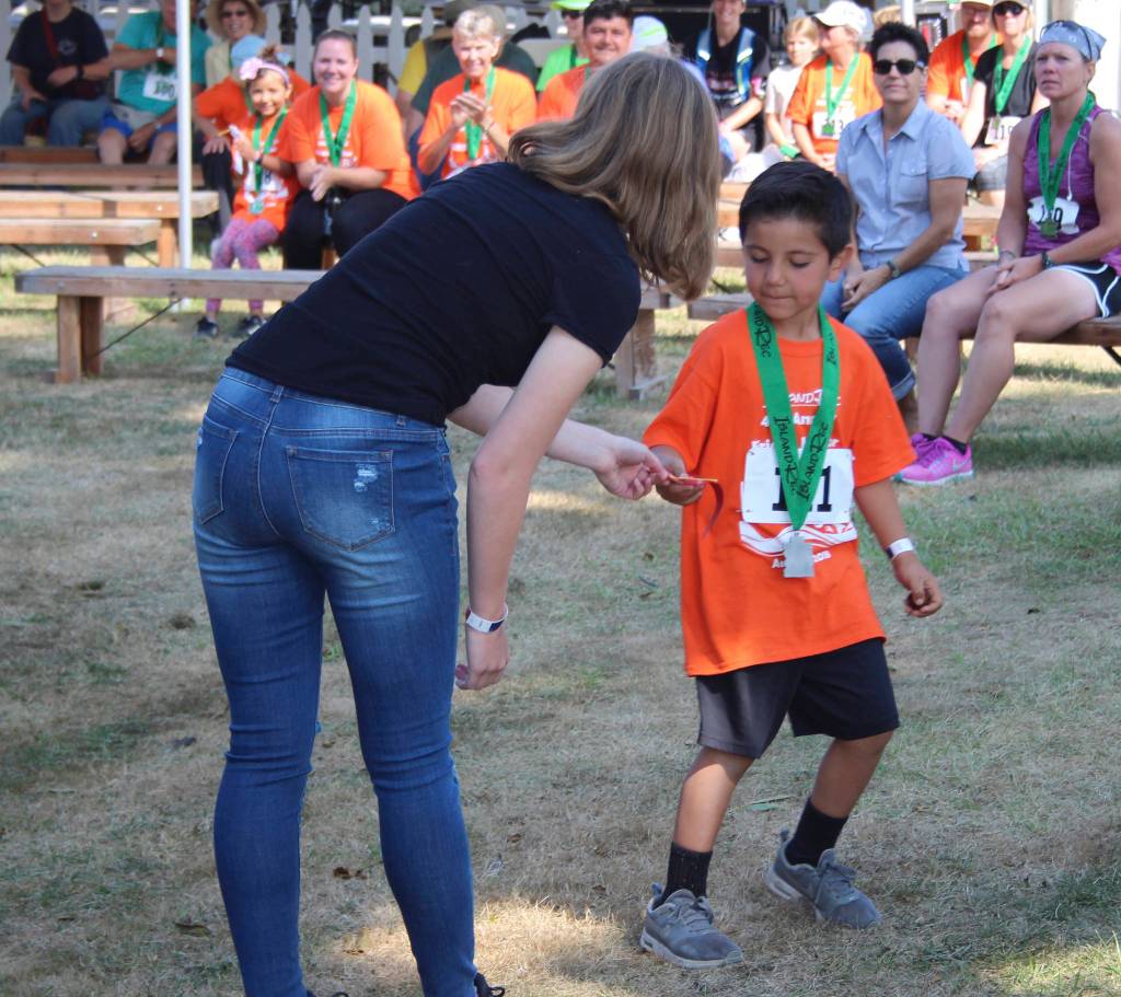 Staff photo/Hayley Day                                Participants attend the medal ceremony after the race.