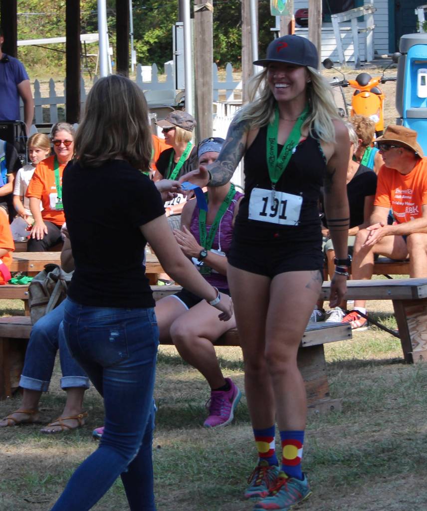 Staff photo/Hayley Day                                Participants attend the medal ceremony after the race.
