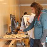 Staff photo/Heather Spaulding. A visitor tries out the centers interactive computers.