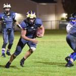 Contributed photo/John Stimpson                                Powerhouse running back, Emeron Geiser, No. 41, takes off up the middle for a big gain on a play. He scored the only touchdown of the game, giving Friday Harbor the win.