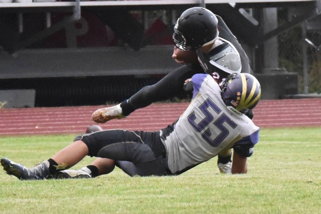 Contributed photo/John Stimpson                                Austin Wynn tackles a Wolves running back.
