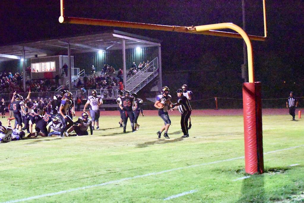 Contributed photo/John Stimpson                                Wolverine running back Emeron Geiser scores his second touchdown against the Wolves.