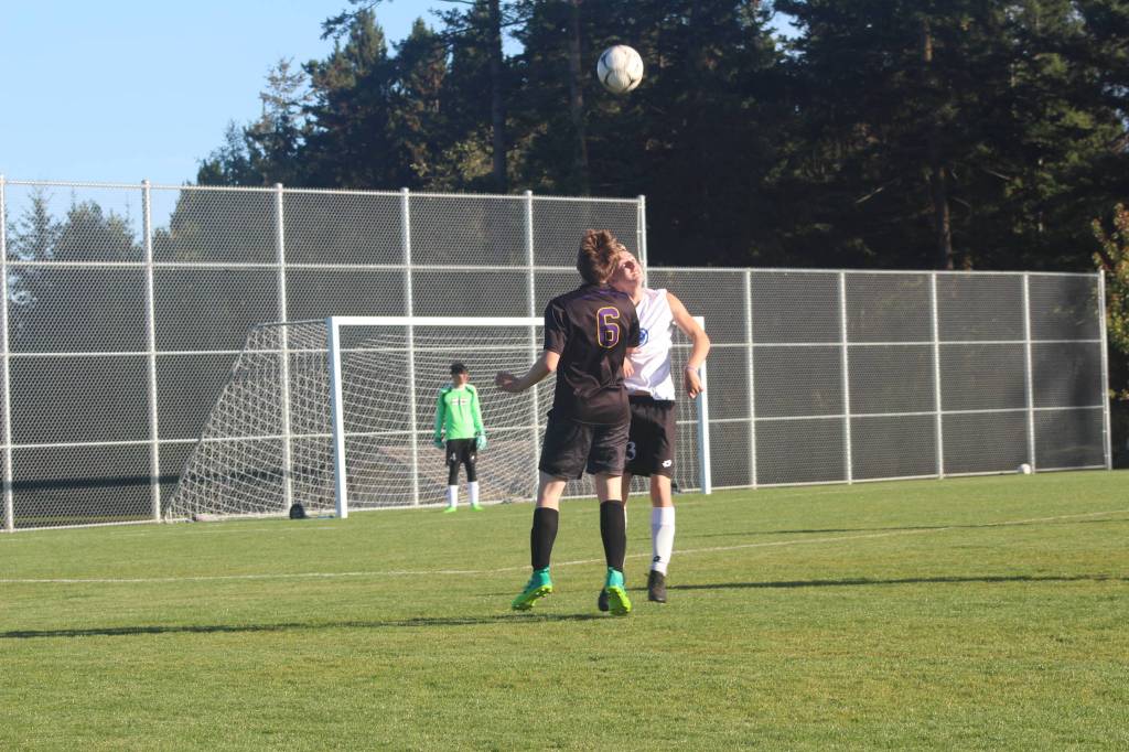 Staff photo/Heather Spaulding. Luke Ericson hits the ball with his head.