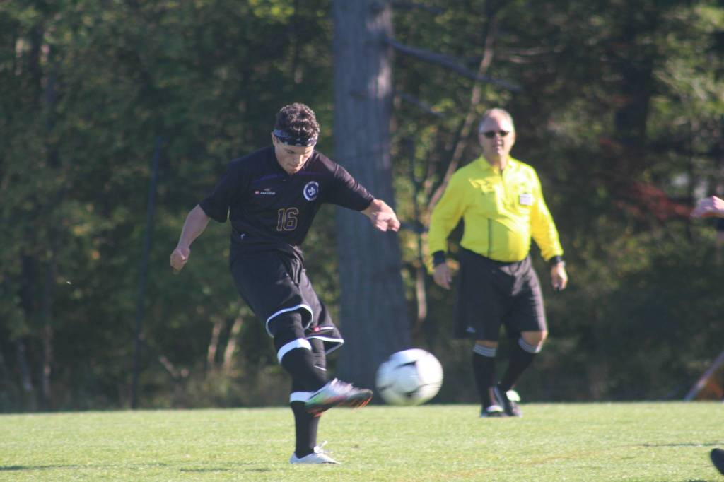 Staff photo/Heather Spaulding. Nick Herko kicks the ball.