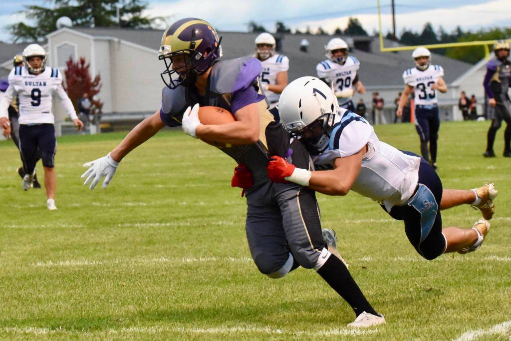 Contributed photo/John Stimpson                                Early in the first quarter No. 22 Kyson Jackson received a pass and ran for a big gain, carrying the defender with him.