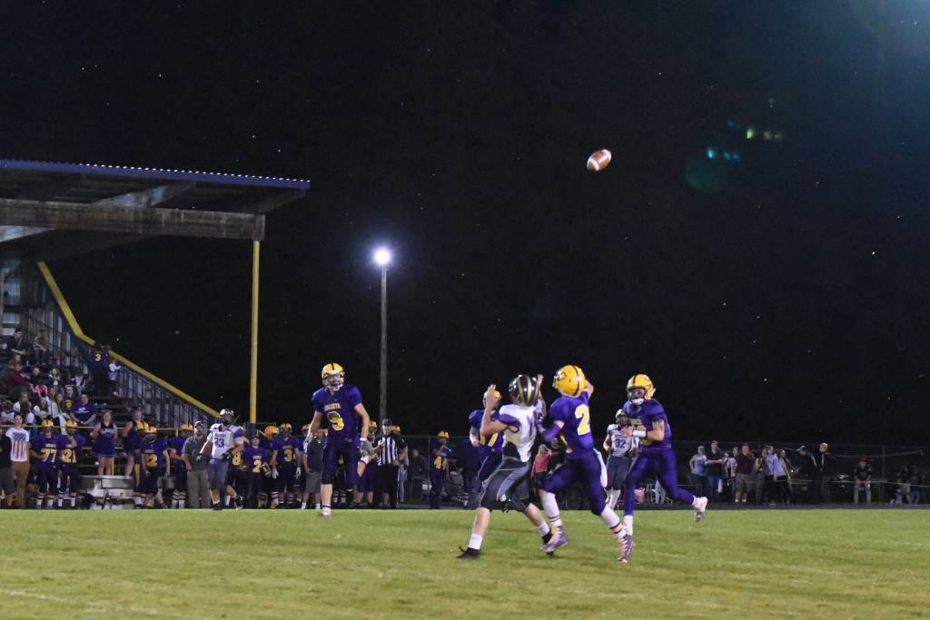 Contributed photo / John k. Stimpson                                Wolverine Jordan Lawson, 14, is on the run to receive a pass for a much needed yardage gain.