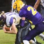 Contributed photo / John K. Stimpson                                Wolverine wide receiver Jordan Lawson, 14, catches a pass and holds on tight for more yards.