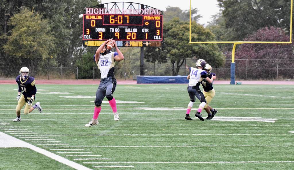 Contributed photo/John Stimpson                                Wolverine Kaden Ritchie pulls in a pass from Jadan Jones and gains needed yardage.