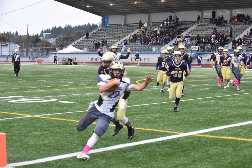 Contributed photo/John Stimpson                                Wolverine running back Kyson Jackson crosses into the end zone scoring the only goal for Friday Harbor.
