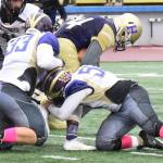 Contributed photo/John Stimpson                                Wolverines Taegen August and Gavin Mason stop the Pirates running back.