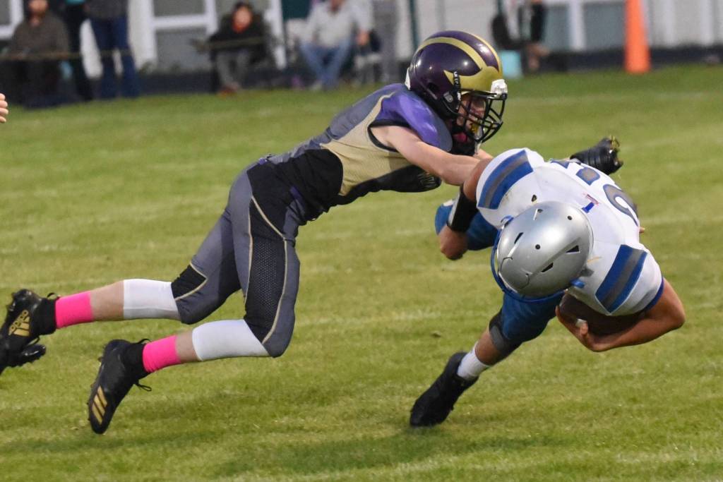 Contributed photo/John Stimpson                                Wolverine Jordan Lawson stops the Braves running back.