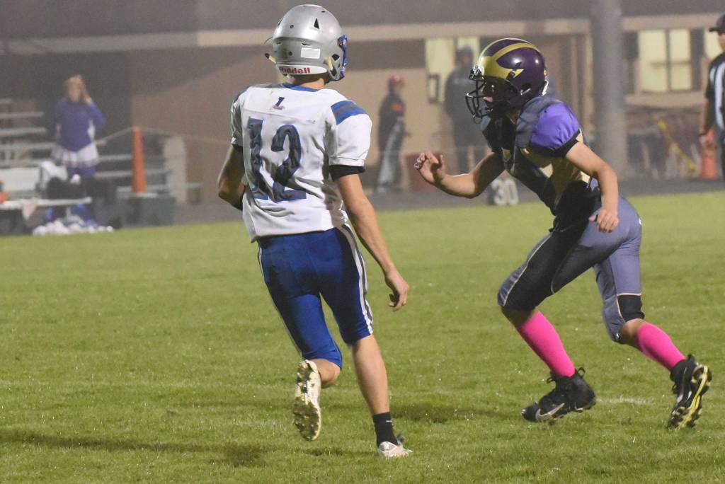 Contributed photo/John Stimpson                                Wolverine Dylan Roberson keeps a savvy eye on the Braves pass receiver.