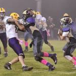 Contributed photo/John Stimpson                                Brian Wolf leads the way for Kyson Jackson on a kick-off return.