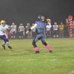 Contributed photo/John Stimpson                                Jaden Jones stays cool under pressure from the approaching Lions while throwing a pass.