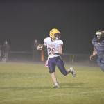 Contributed photo/John Stimpson                                Wolverine Austin Wynn chases down the Lions quarterback for a loss in yards.