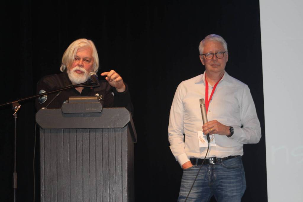 Staff photo/Heather Spaulding. Paul Watson and Rocky Collins on stage.