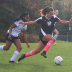 Staff photo/Hayley Day                                Alex Holman, No. 12, soars toward the ball on Oct. 30.