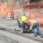 Contributed photo                                A construction worker pushes Aaron DErrico up Tucker Avenue when his previous scooter fails.