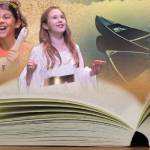 Staff photos/Hayley Day                                Sophia Ramirez sings as Ratty in the play, but is dressed as Tiger for Halloween. As Toad, Kira Clark sings while wearing her angel Halloween costume.