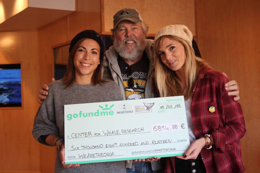 Staff photo/Heather Spaulding                                Staff photo/Heather Spaulding. Morgane Trussardi and Lea Camilleri present donation to Ken Balcomb.