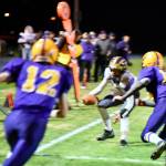Contributed photo/John Stimpson                                Wolverine Quarterback Jadan Jones scores the touchdown amid Lions defenders.