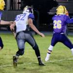 Contributed photo/John Stimpson                                Wolverine Jonny Olsen rushes the Lions quarterback.