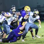 Contributed photo/John Stimpson                                Wolverine Kaden Ritchie fights to gain more yards.